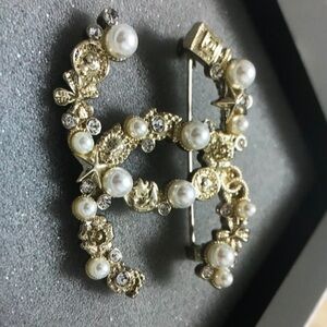 Chanel Gold brooches